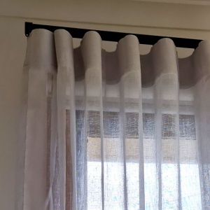 Wave fold sheer installed over window