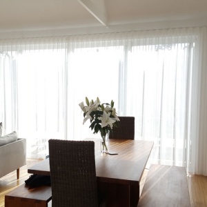 S Fold sheer curtains installed on dining window